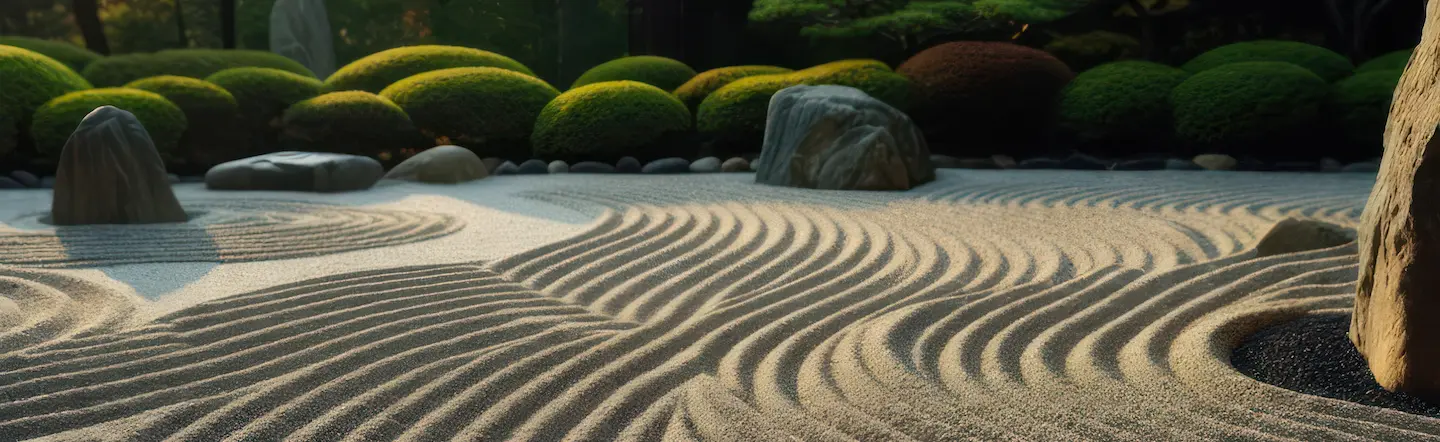 Zen-Garten mit Steinen und Sandmustern – Symbol für innere Balance und energetische Klärung während einer CQM-Sitzung